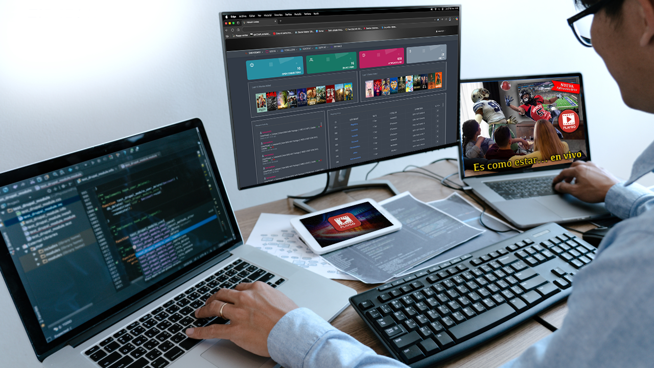 Persona trabajando en una oficina moderna con un portátil y papeles, plantas decorativas y otras personas en segundo plano.