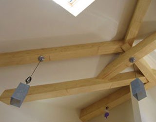 These beams were installed to create a 14-foot lofted ceiling; they are both structural and aesthetic. 