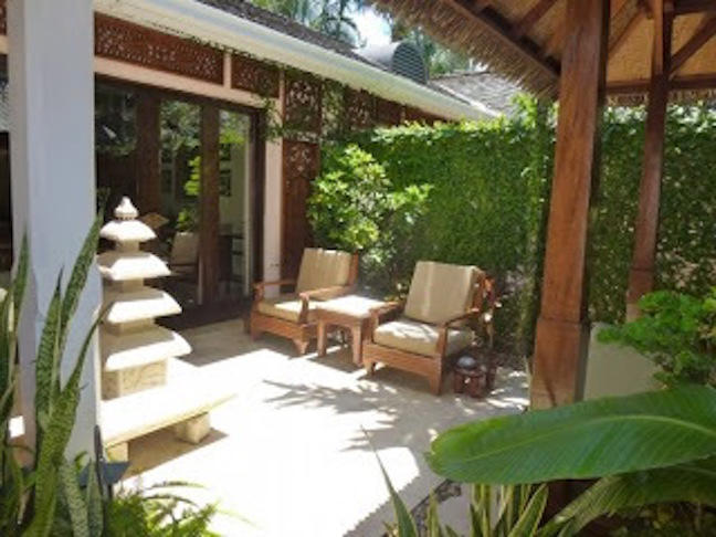 Even small spaces can be transformed with green fences, a few lush plants and sitting areas. 