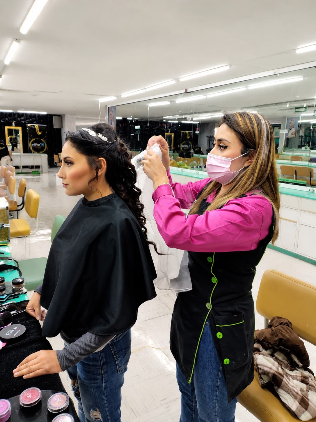 Luxury spa salon with therapists giving massage and facial treatments, candles, skincare products, and relaxing wellness atmosphere
