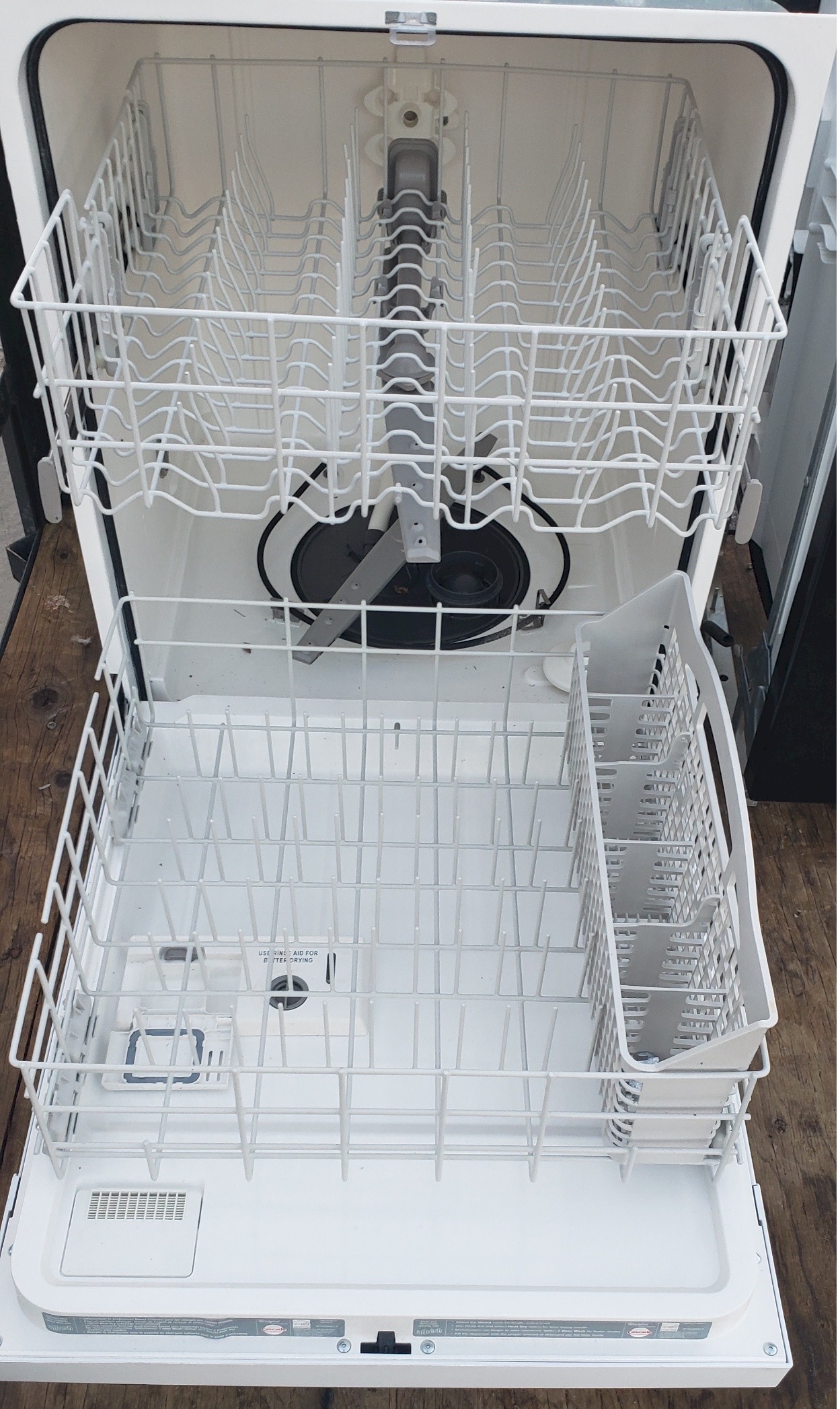 1 White Whirlpool Dishwasher inside