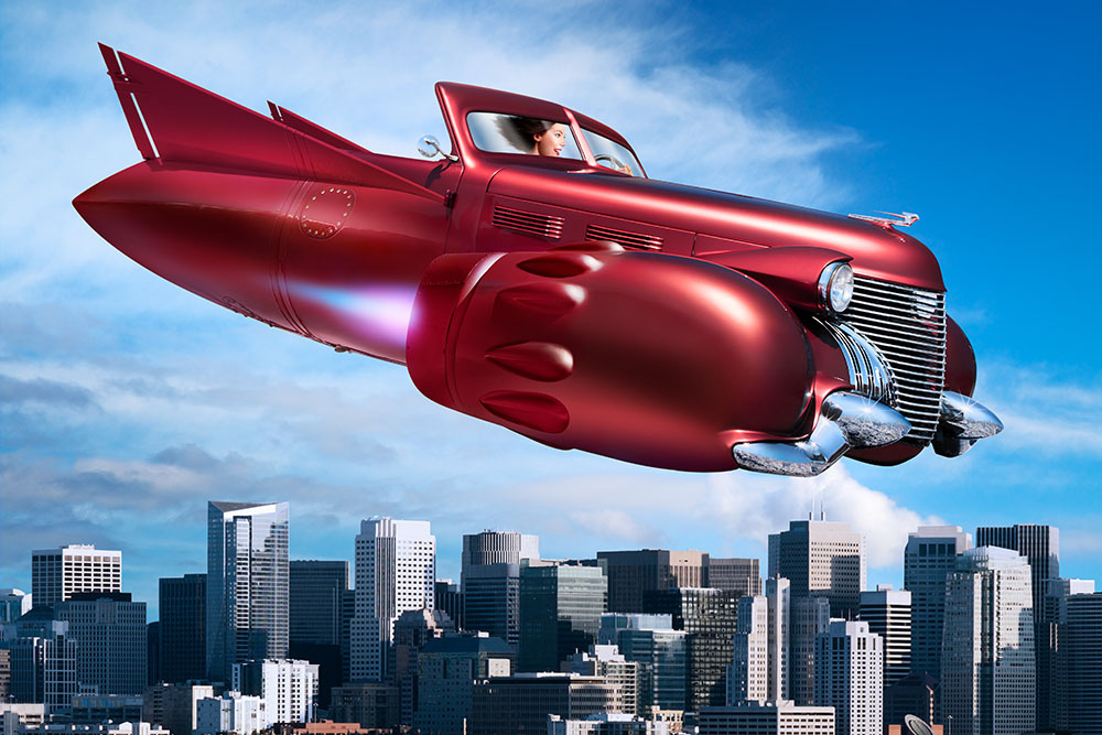 A science fiction image of a woman driving a flying car made from a vintage car, but with jet engines and tail fins, over San Francisco.