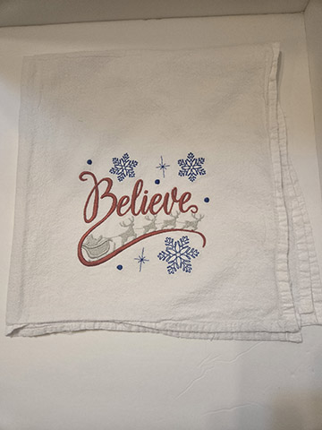 Flower sack towel featuring a believe in Santa design