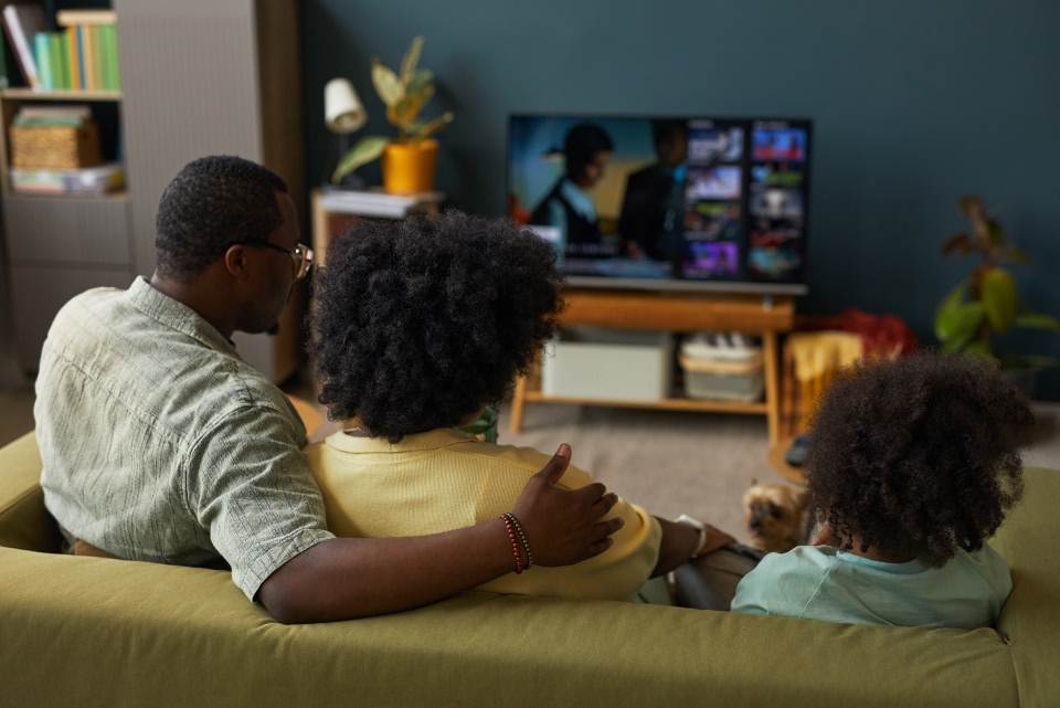 A family gathered watching the television