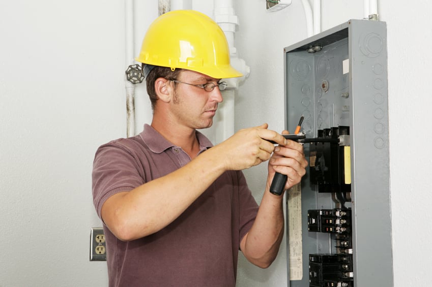 Electrician checking on electric circuits