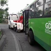 Man in a sportsware riding a bike