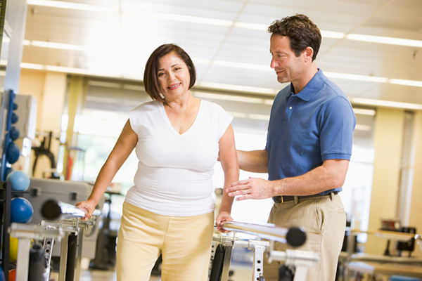 Physiotherapist helping a patient in rehabilitation Physiotherapist helping a patient in rehabilitation
