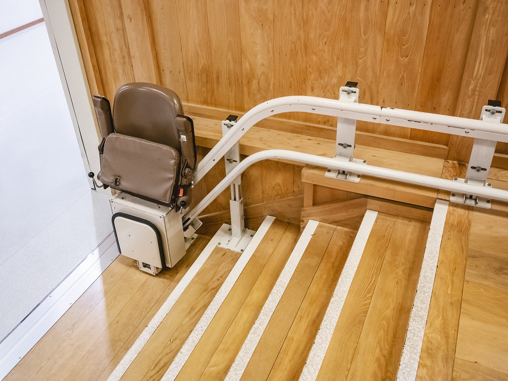 Stairlift on wooden staircase
