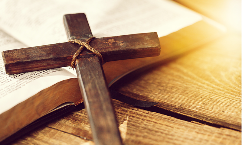 Holy Bible book and cross