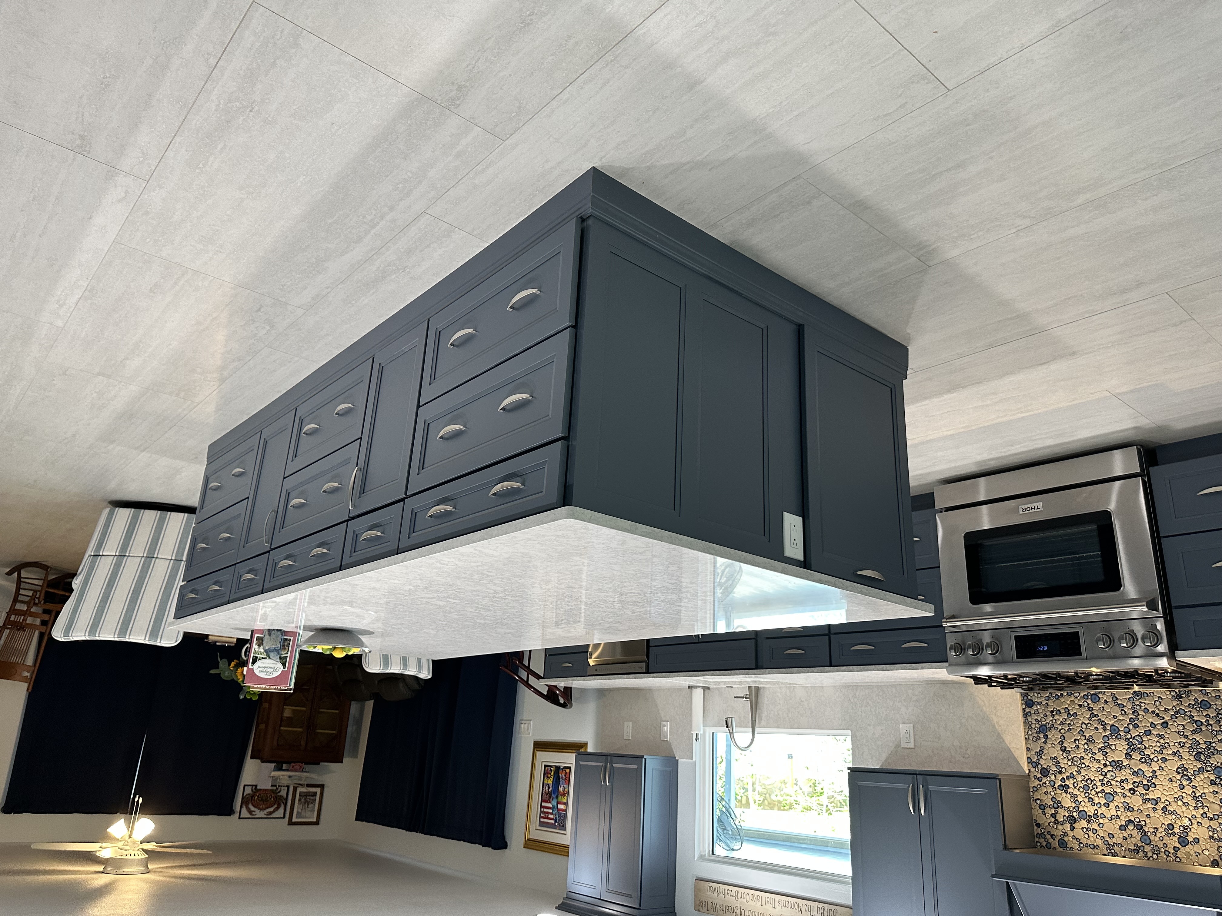 A massive island topped with premium Cambria quartz, offering generous prep space and additional storage for all your kitchen essentials.