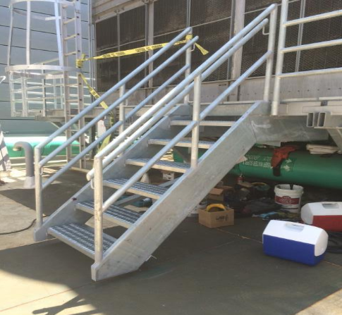 Steel stairway leading to a steel landing.