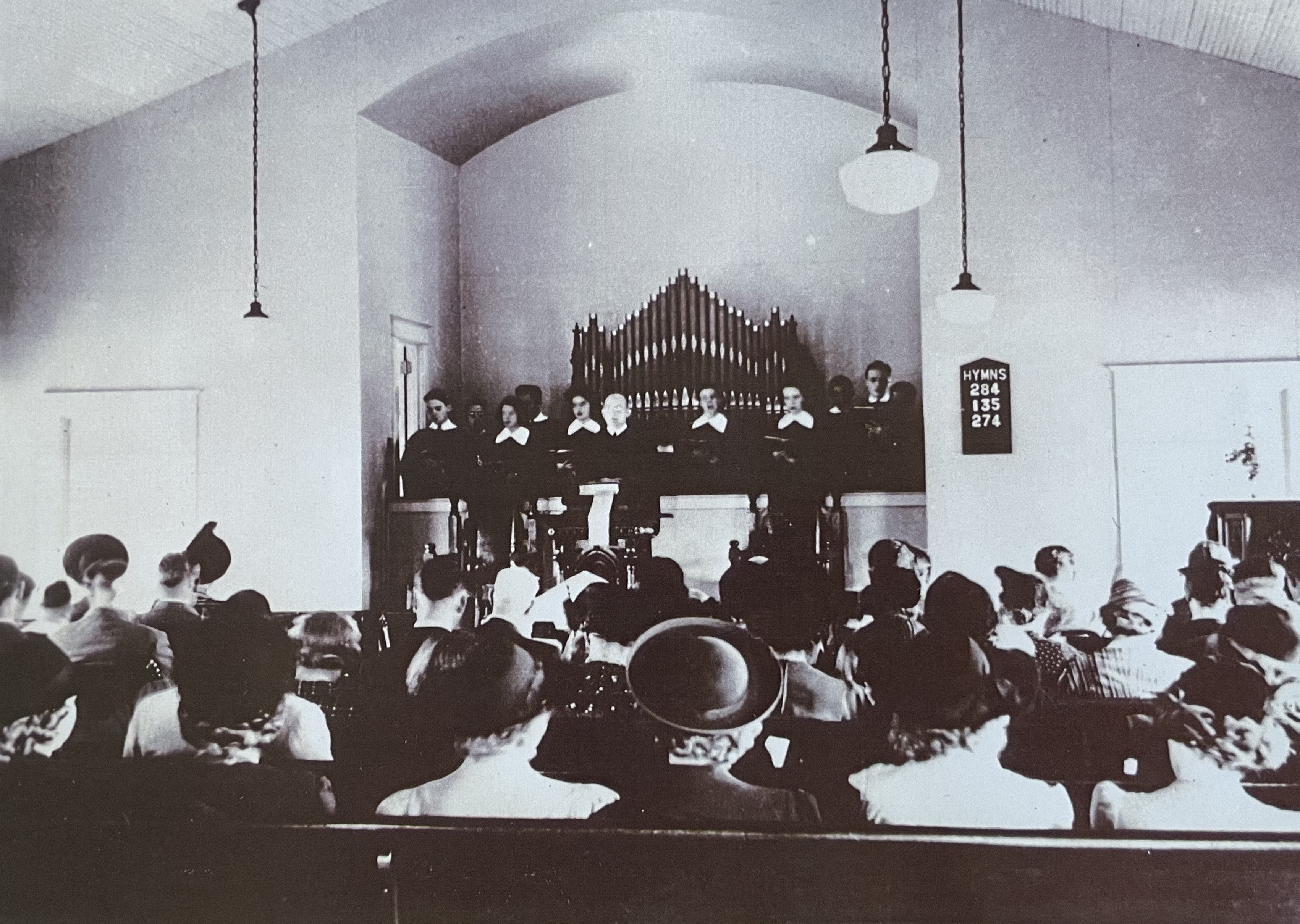 The choir loft was built, a vestibule added, and a small basement was built to house a furnace which previously stood inside the church - 1937.