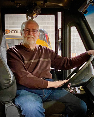 Ron F trained with Reggie 9/2023 and received his CDL a month later. He did a van route for awhile, now driving a big bus. He likes dealing with kids of all ages, especially seeing the energy on his elementary routes! Ron also likes woodworking using a lathe, making items as small as writing pens. Plus he’s good with new technology like Apple’s Home automation.