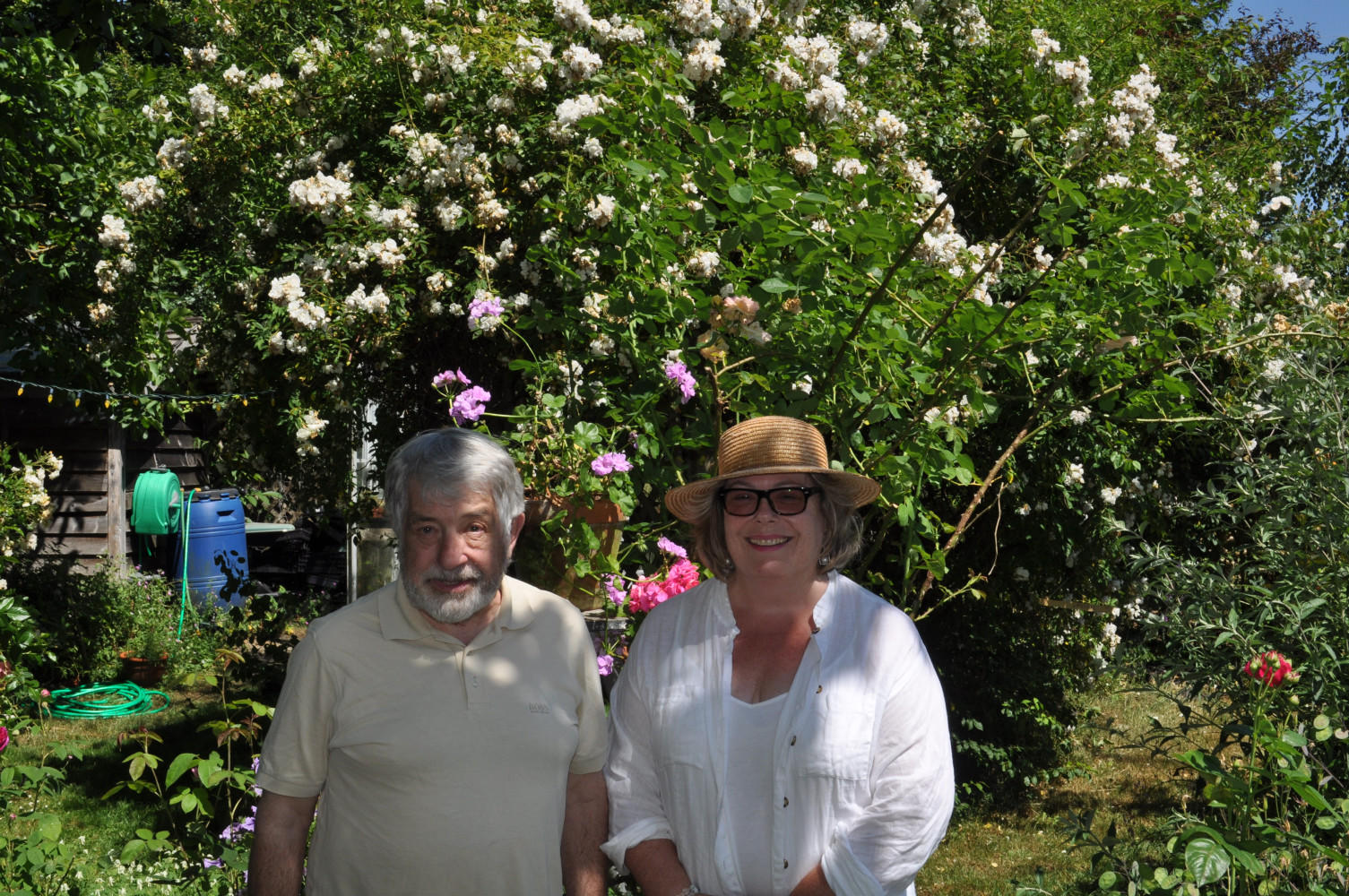 Elizabeth and Don in their joyful, riotous garden in Langley.