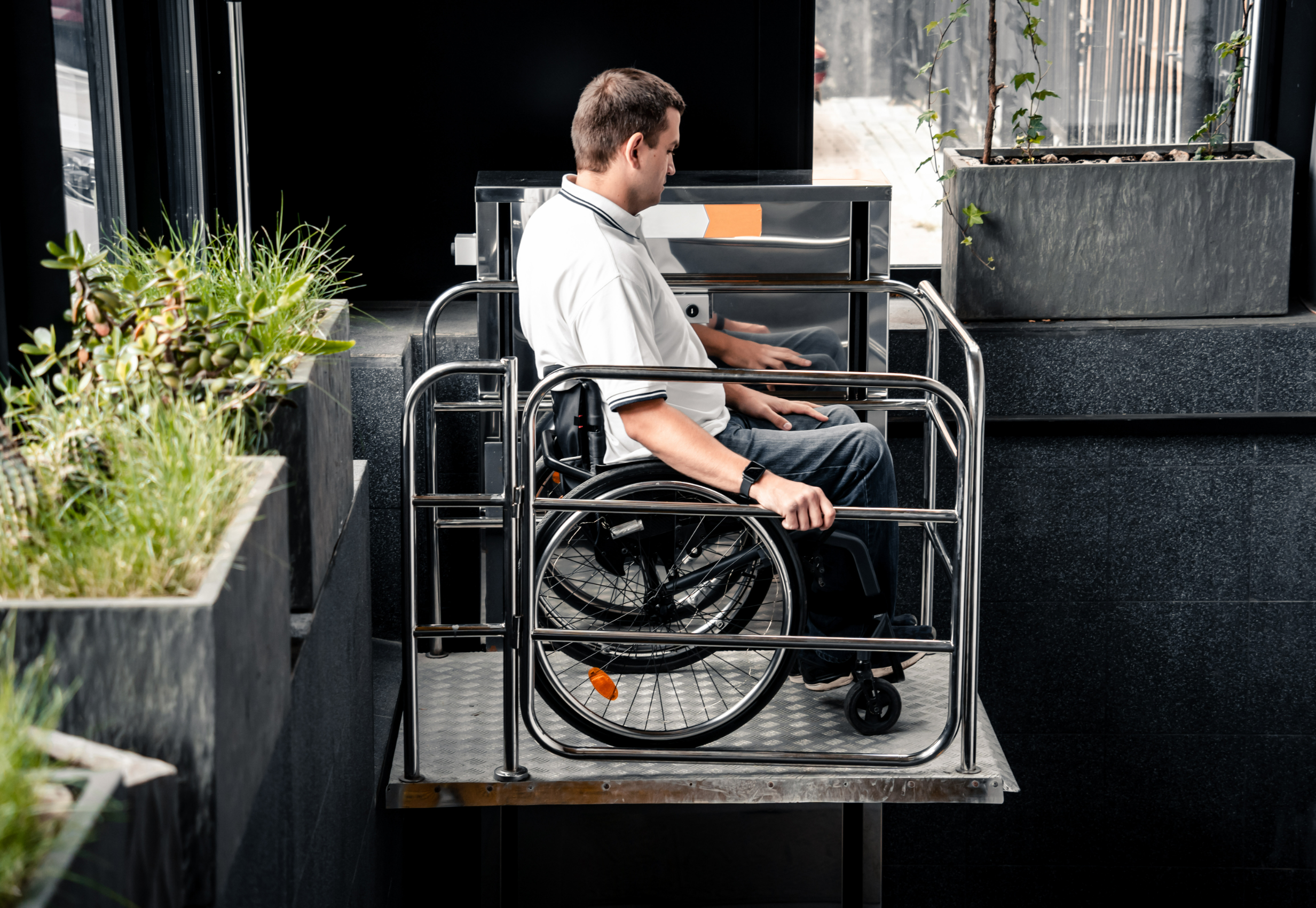 man using wheelchair lift