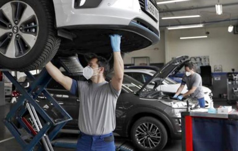 Hands over a car model