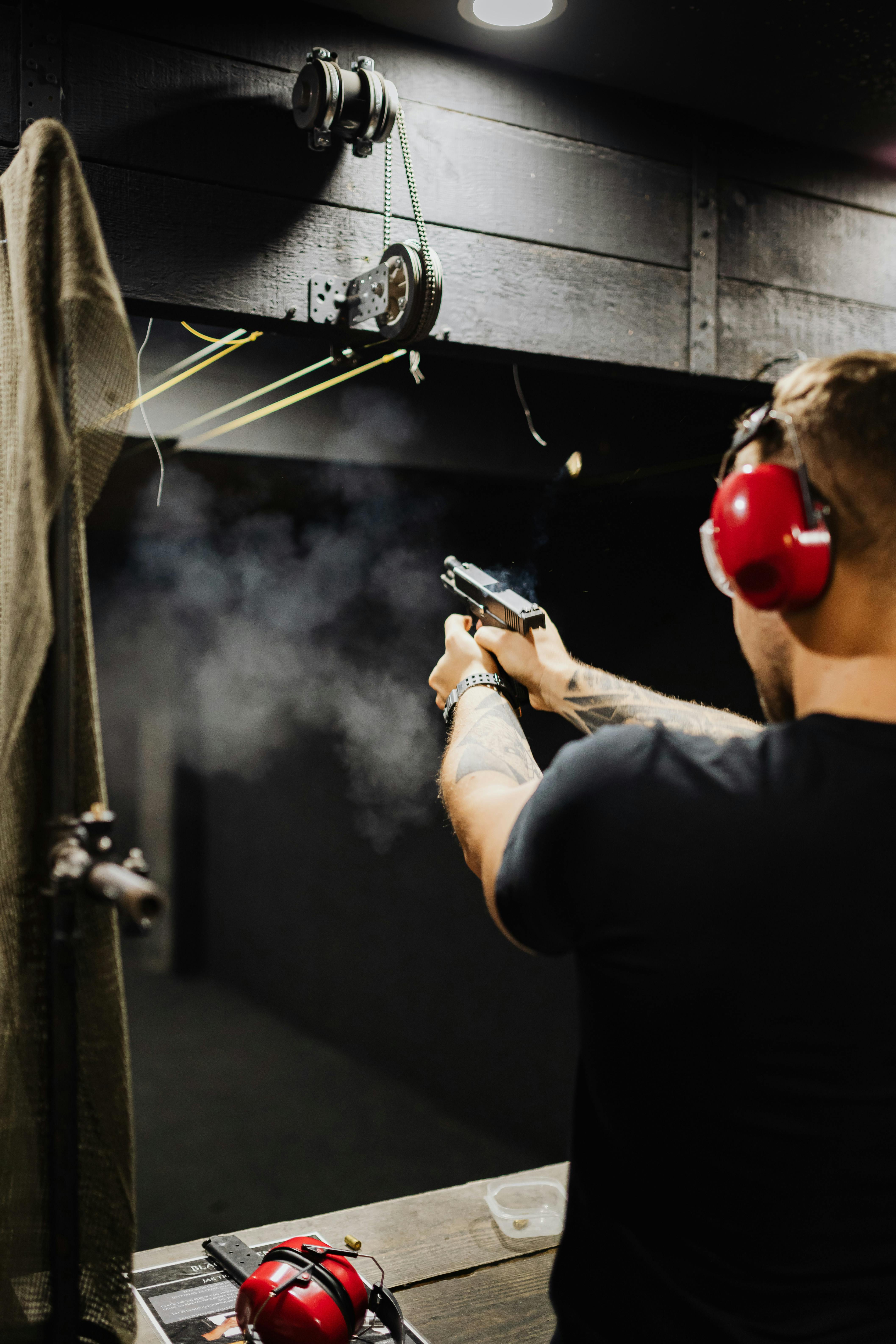 Man aiming a gun at a target