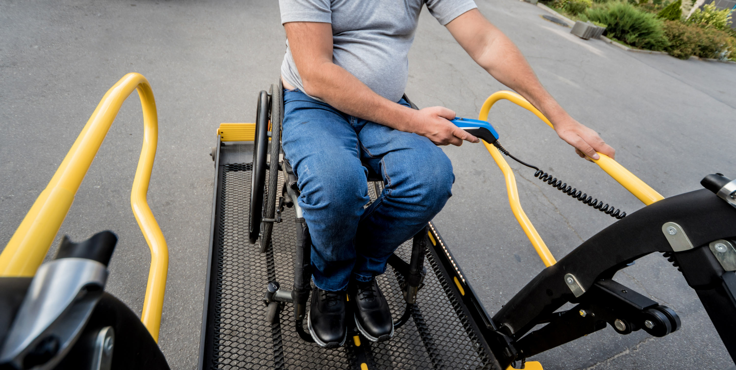 man getting off scooter lift