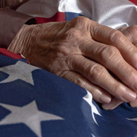 Hands Holding An American Flag