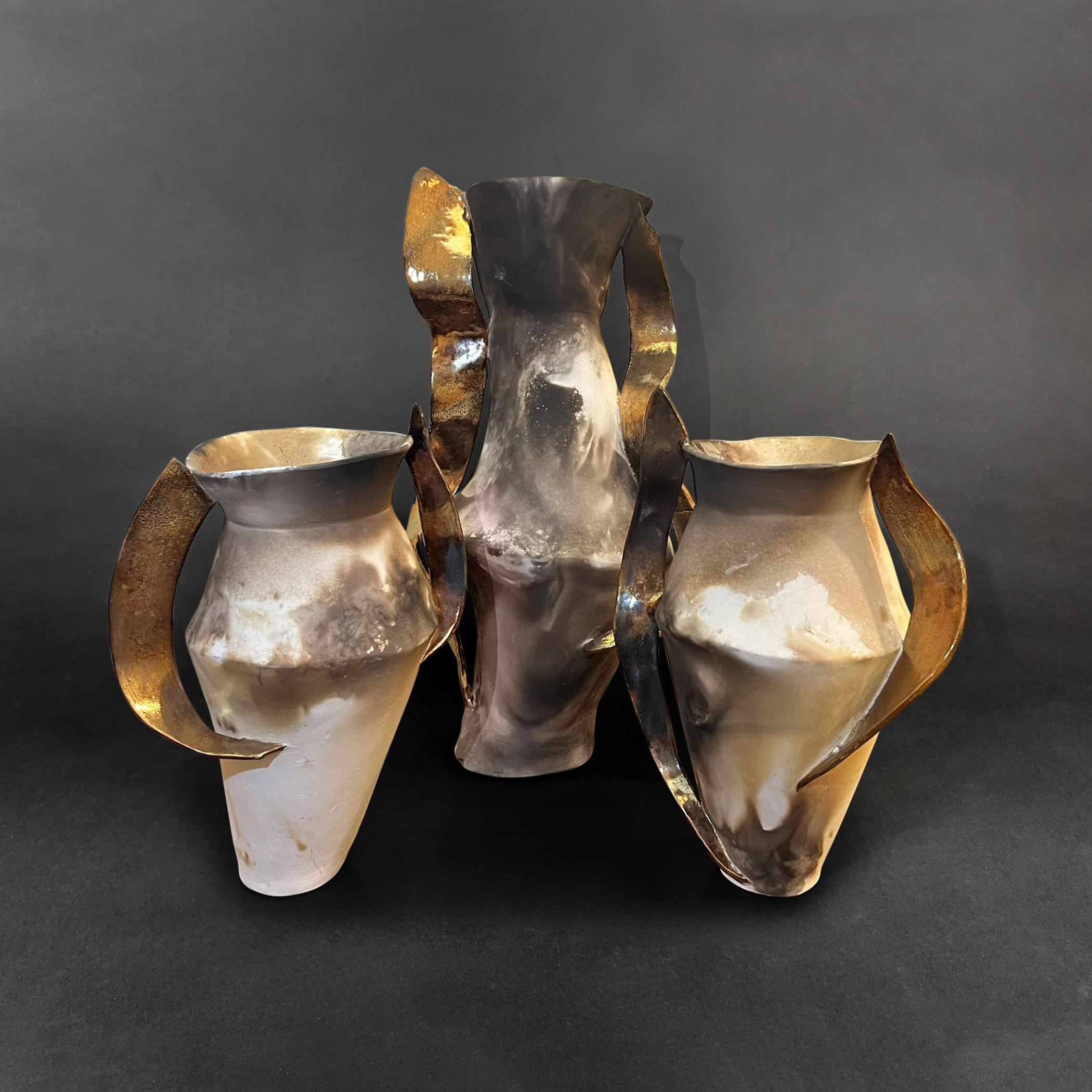 Three Winged Avengers
pit-fired, gold-lustered porcelain
22" h x 24" w x 14" d