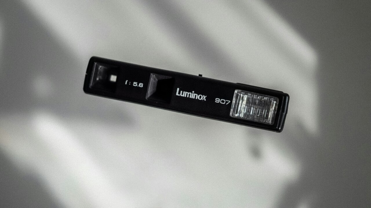 Vintage Luminox 907 camera on a blurred gray background. Vintage Luminox 907 camera on a blurred gray background.