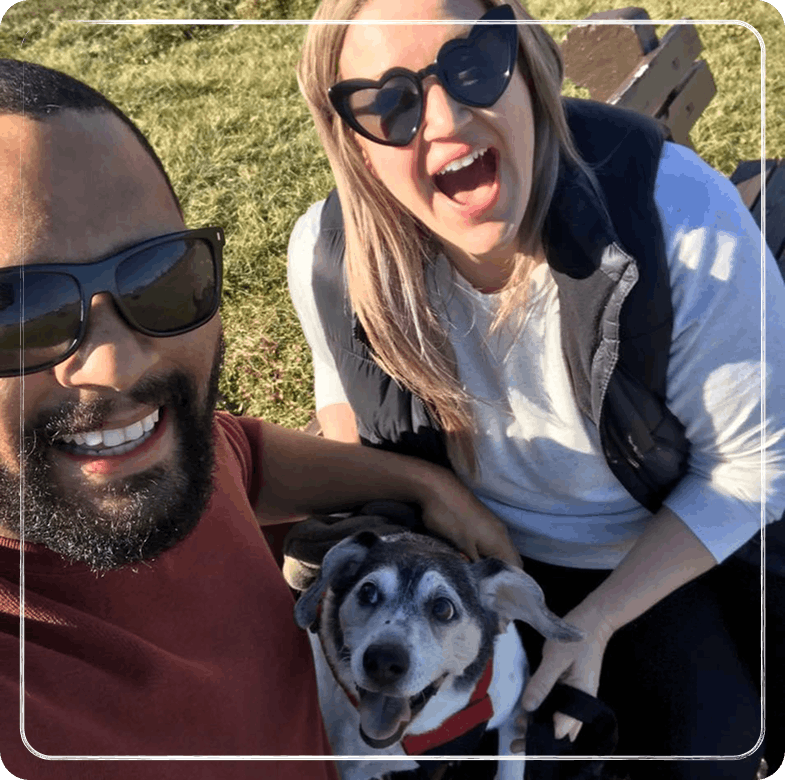 A man and a woman with a dog