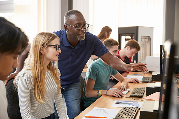 Mature instructor helping students