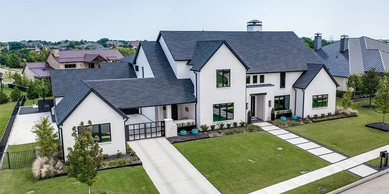Artwork of a large home on green grass
