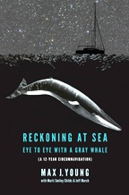 "Reckoning at Sea" book cover, depicting a sailboat at sea beneath a starry night sky, as a submerged gray whale approaches ominously