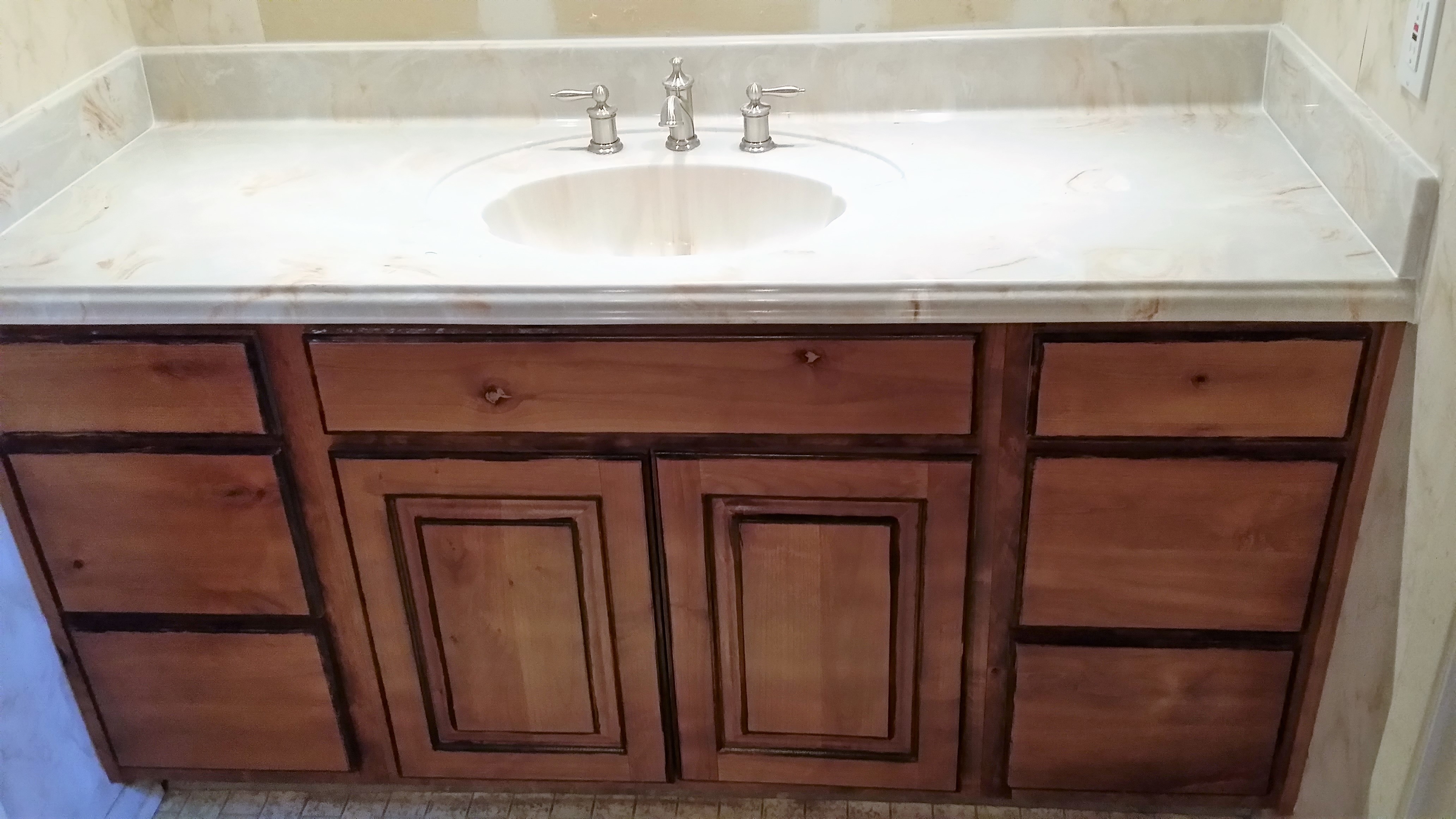 Golden Oak/Walnut Glazed Knotty
 Alder featues six soft close full
 extension drawers and two raised panel
 doors with two slide out drawers.