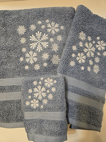 Blue towel set featuring a snowflake design