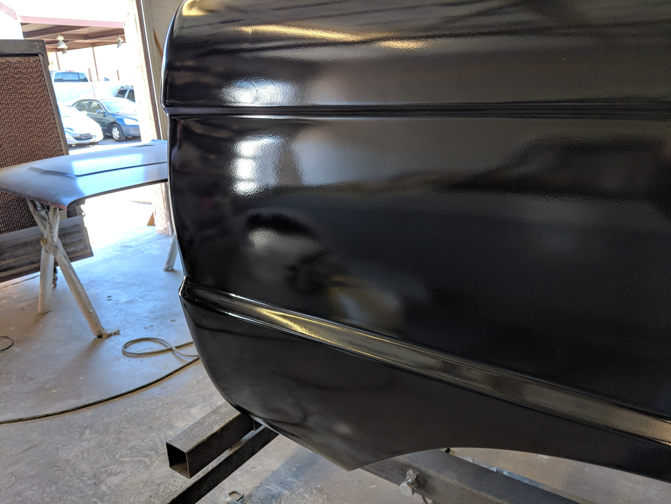 Filled in body seam where quarter panel meets meets tail light bucket