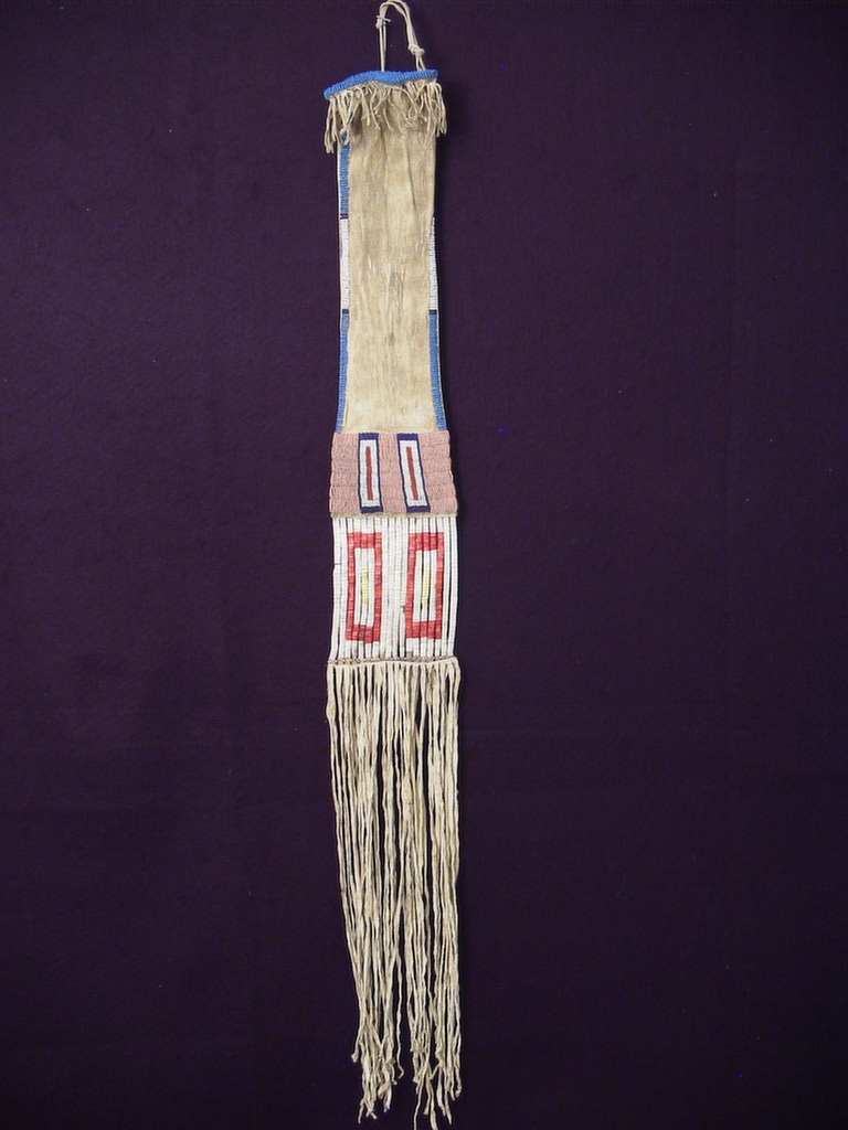 PRODUCT PROFILE :
Product No. : #10015
Description :  SIOUX QUILL & BEADED PIPE BAG
PRODUCT NARRATIVE :
• Quilled parfleche panels, long fringe
• Pink background front and reverse, Sioux elements
• Circa: 1880