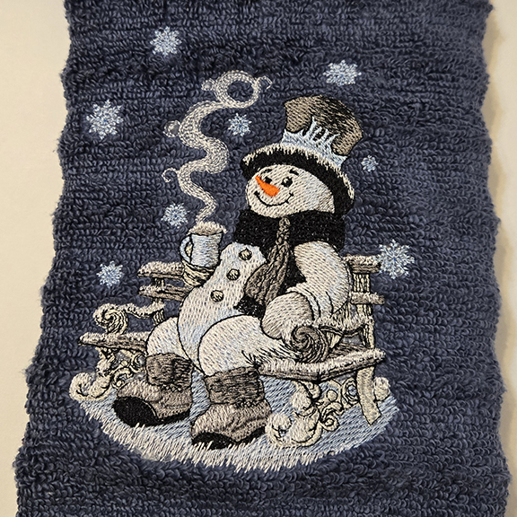 https://0201.nccdn.net/1_2/000/000/166/faf/snowman-on-bench-blue-hand-towel.png