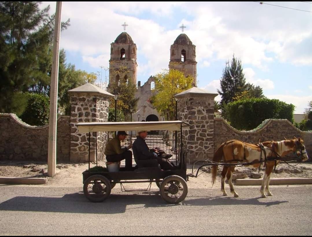 Stack of coins in front of a clock