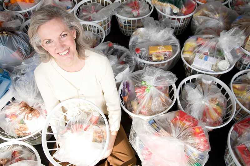 Woman with baskets of groceries