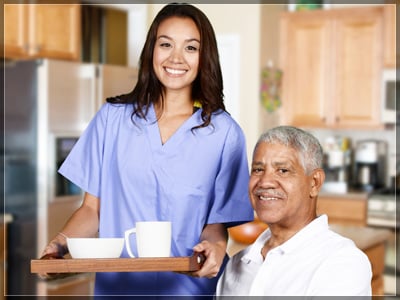 Health Care Worker And Elderly Man