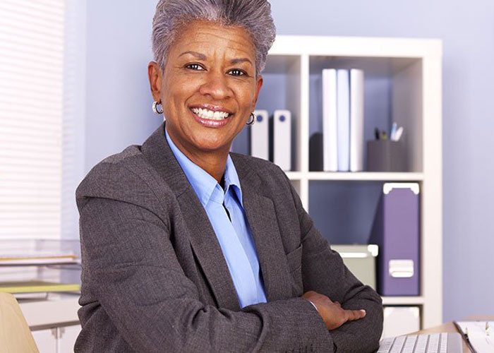 Business Woman Sitting at Desk 