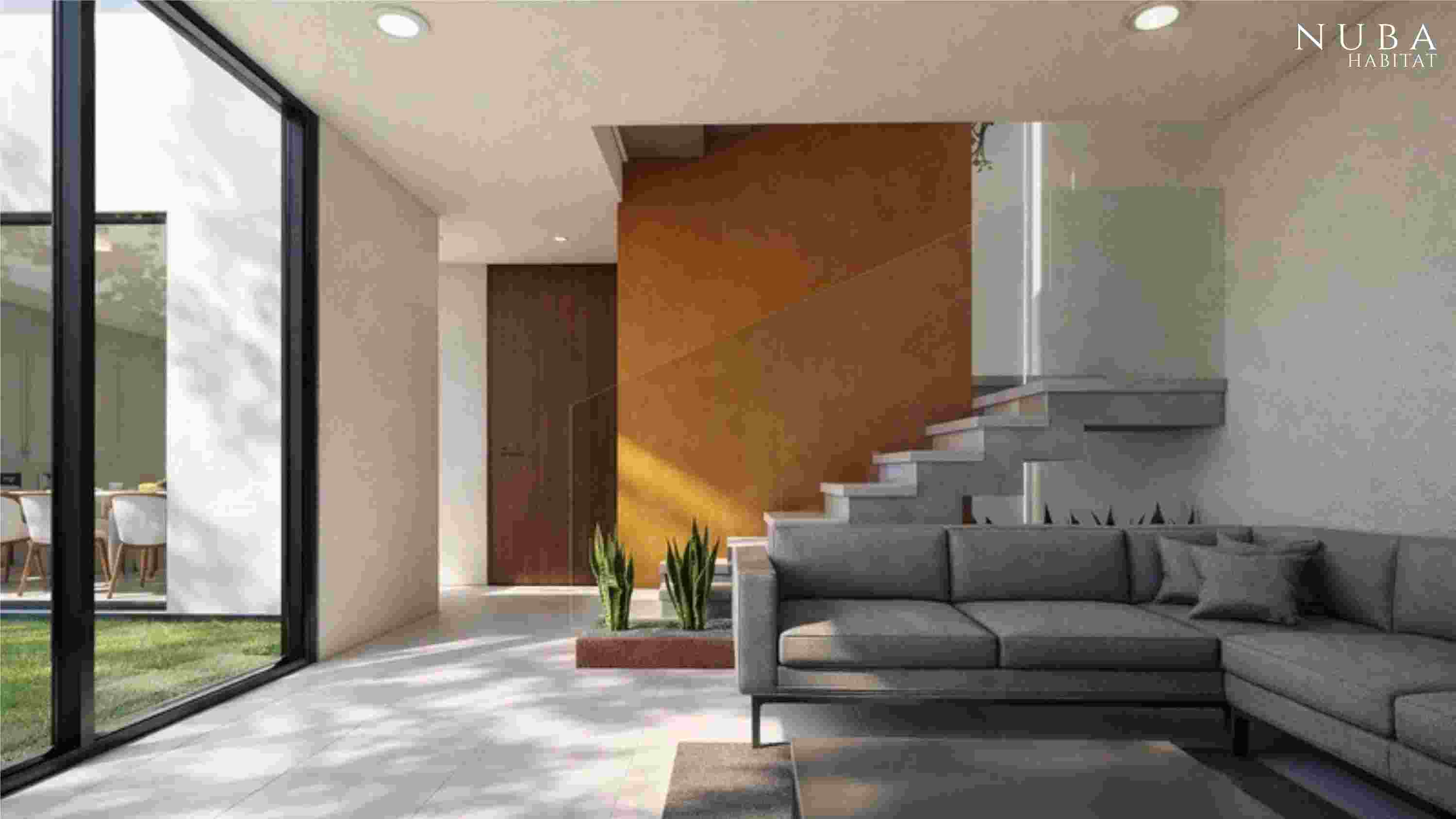 Casa moderna con diseño arquitectónico curvo, rodeada de naturaleza y reflejándose en el agua al atardecer.