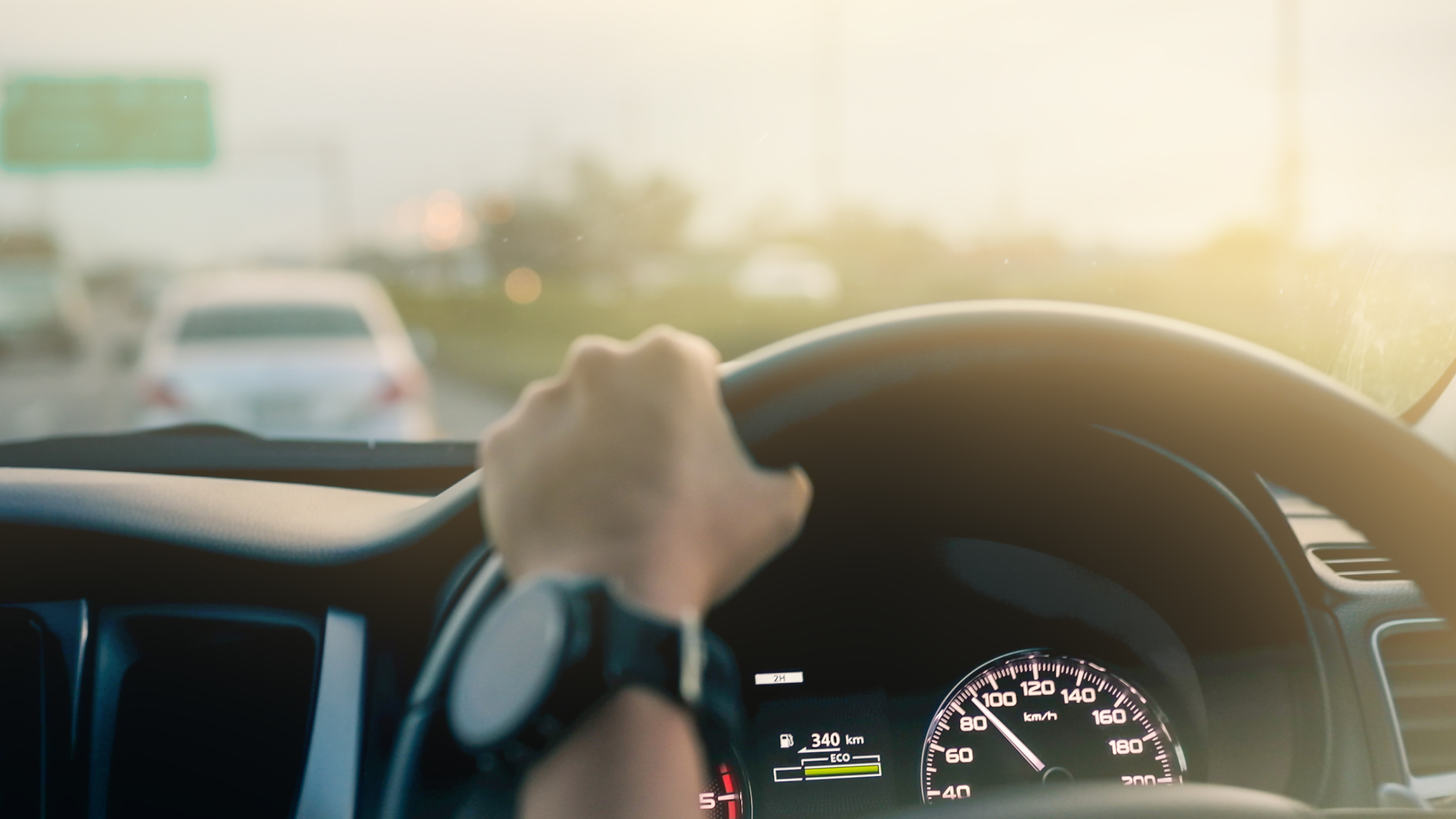 Driver hand on steering wheel