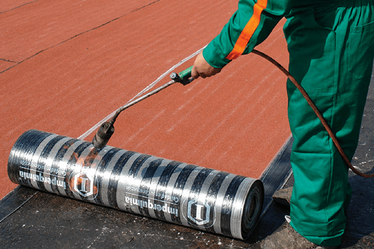 Woman wearing a pink dress and grey boots