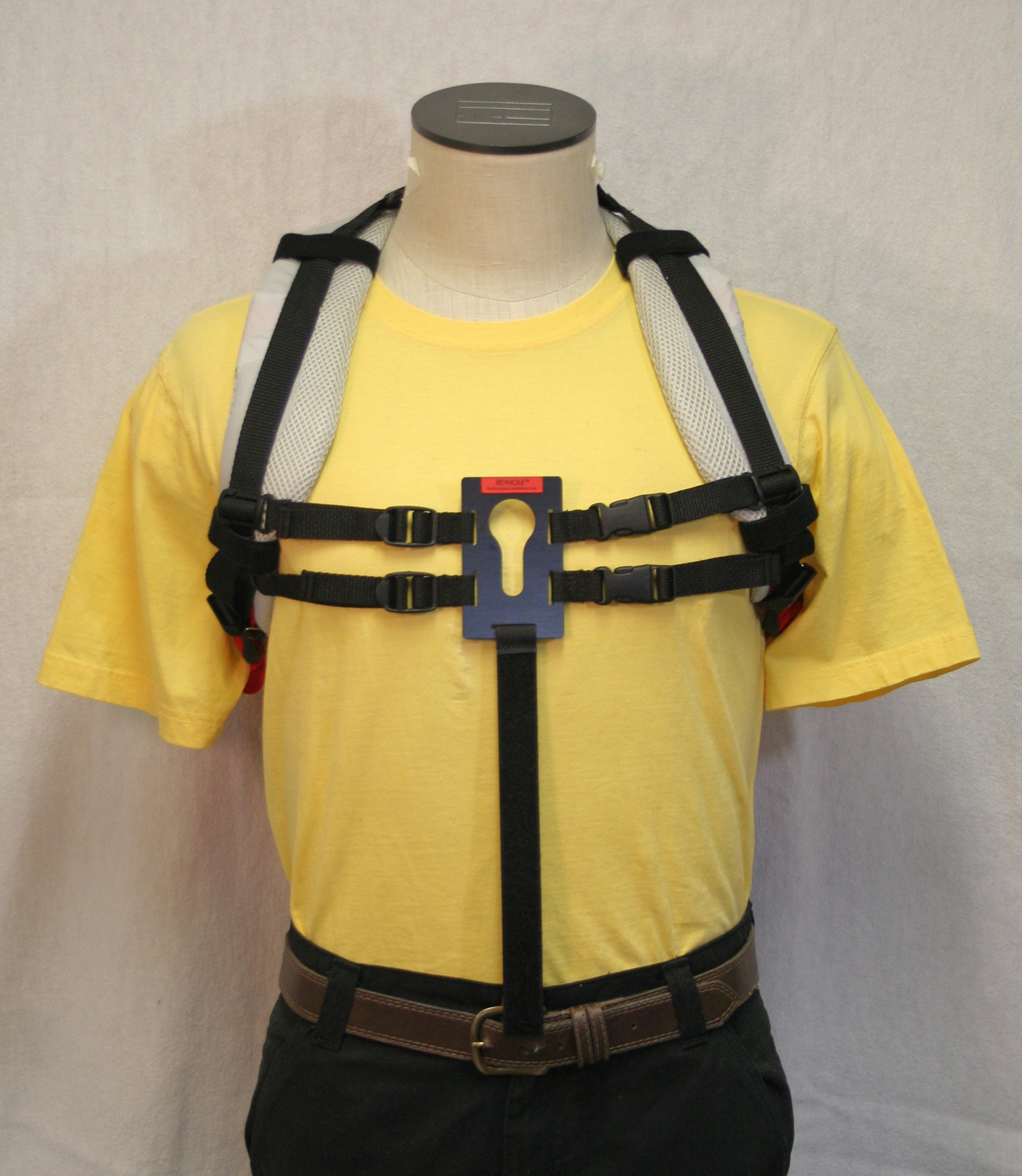 UNIVERSAL KEYHOLE® attached to backpack shoulder straps