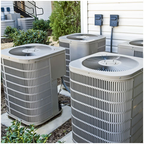 Group Of Air Conditioning Units At Apartment Complex
