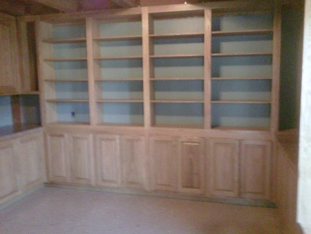 Office cabinets feature raised paneled doors,
 arched upper doors, adjustable shelves and desk. Colonial
 Maple hand wiped stain with clear coating finishes red oak wood.