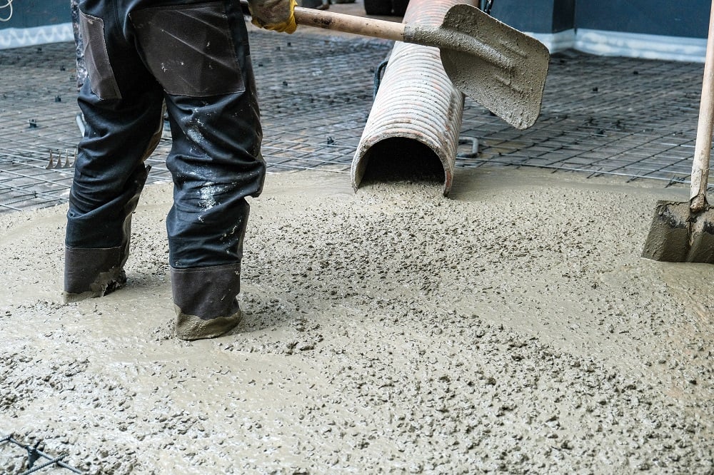 Worker Pouring Concrete