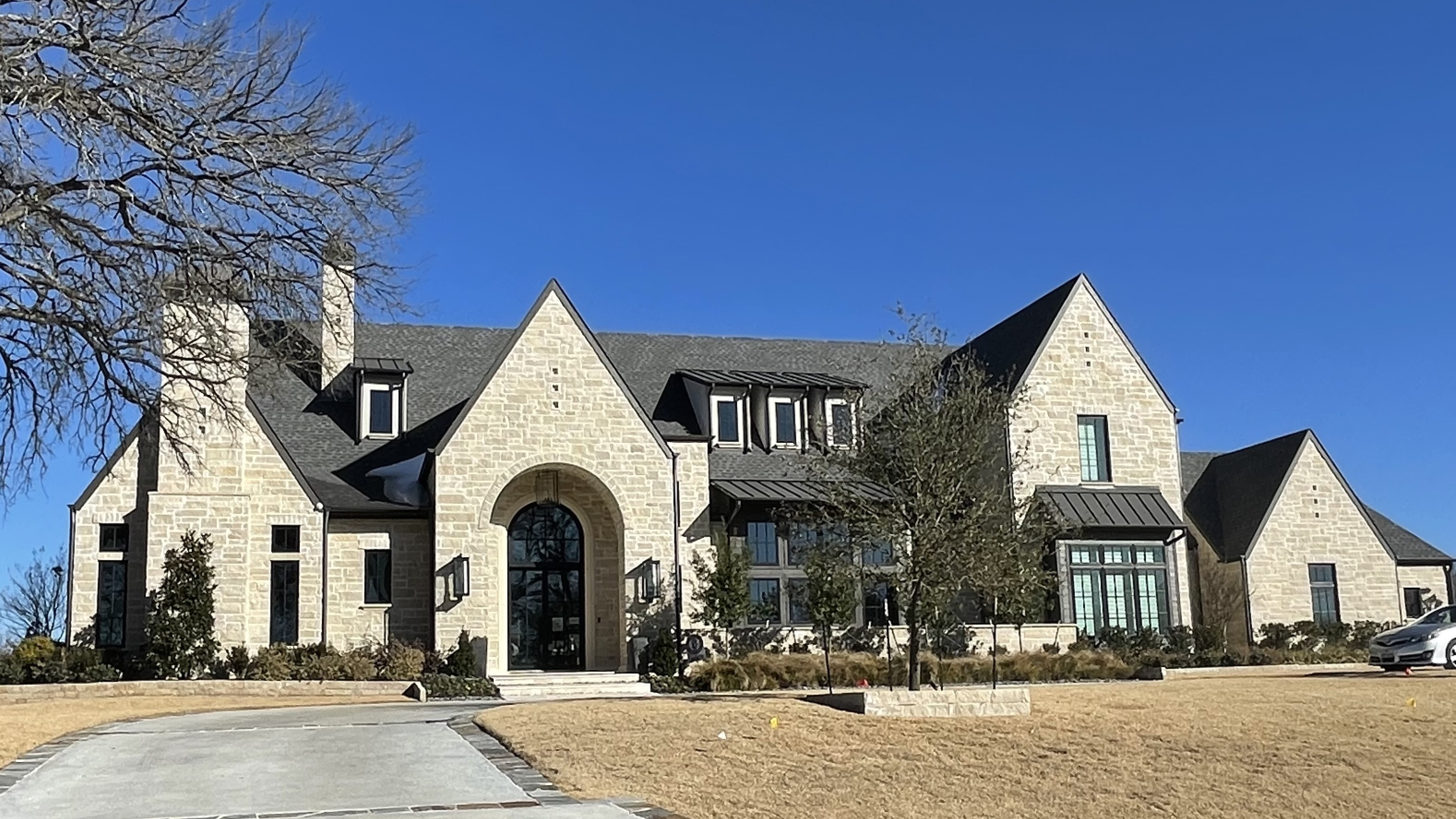 A stone and white home