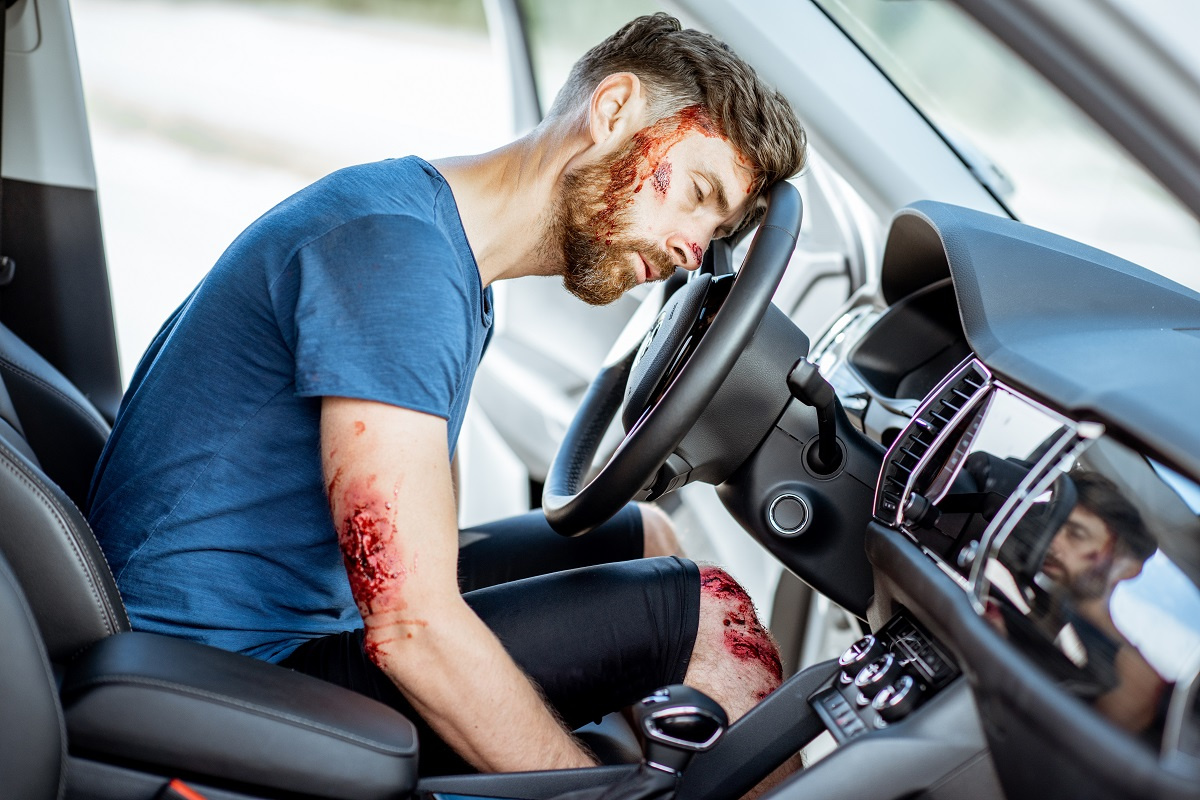 Bleeding man in car
