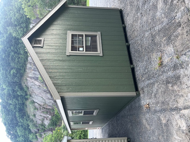 This beautiful 12x24 New England Deluxe Cape Cod Cottage featuring Pequea Green colored wood siding, Clay colored New England trim, and it also featured the Driftwood colored architectural shingles with synthetic underlayment.  This structure was also equipped with classic gable ventilation, 5 30"x36" double hung insulated house windows, 1 3'x75" 9 lite fiberglass house door, a 4x12 porch with composite decking along with vinyl railing, pressure treated floor joists, and skids.
  
  
  
  
  
  
  
  
  
 
