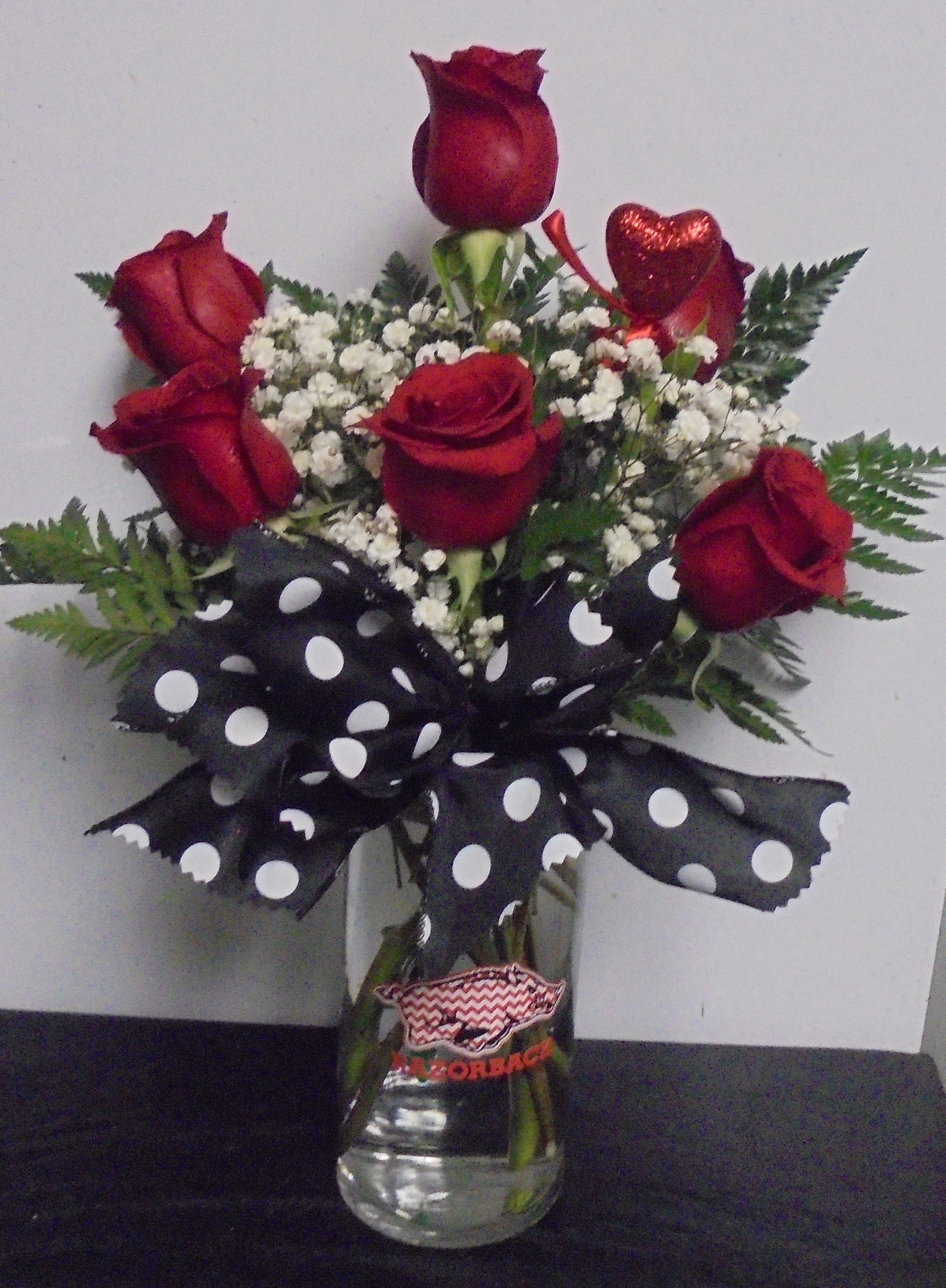 (7) "Half" Dozen Roses
In Razorback Vase
$65.00