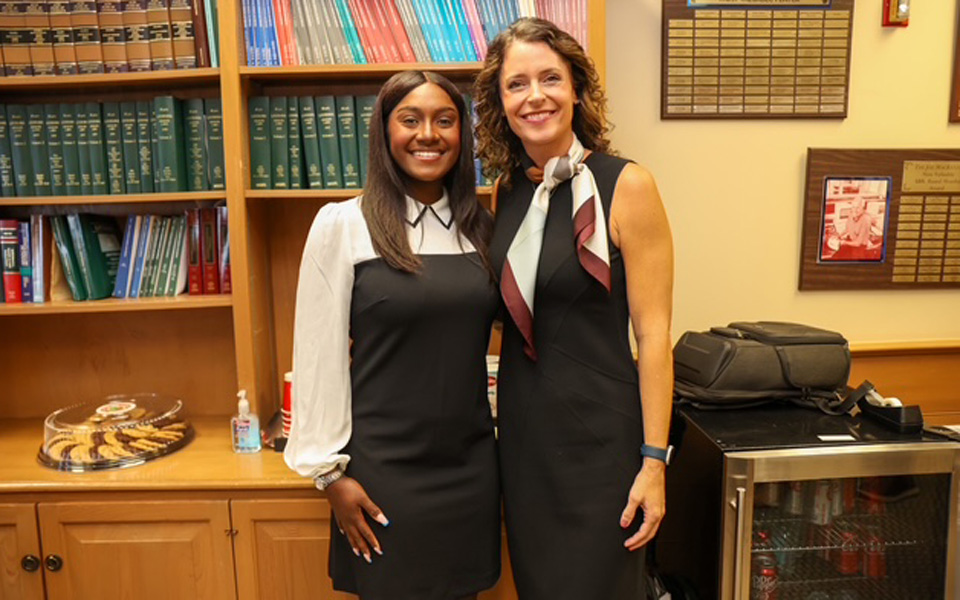 Two colleagues in an office library